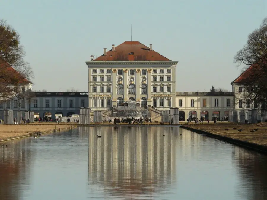 Nymphenburg Palace and its reflection in the clear pond on a hazy day - one of the best things to do in Munich