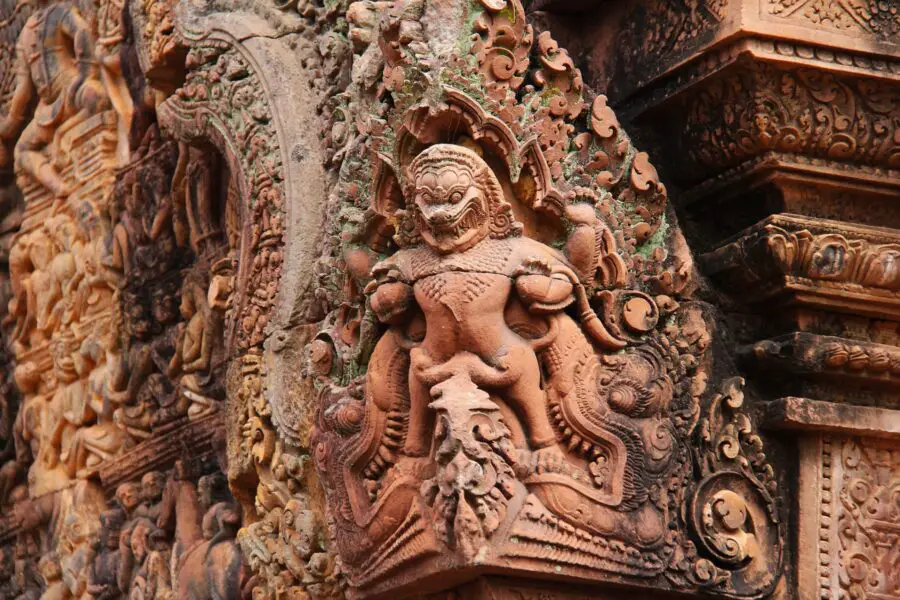 The tanned intricate carvings into the stone walls of the Banteay Srey Temple near the Cambodia Landmine Museum in Siem Reap