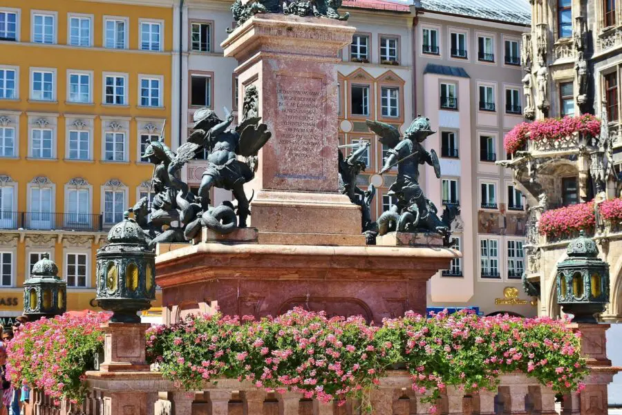 The statues surrounding the four corners of the Mariensaule stationed in the middle of Marienplatz, the most popular stop on our free walking tour of Munich