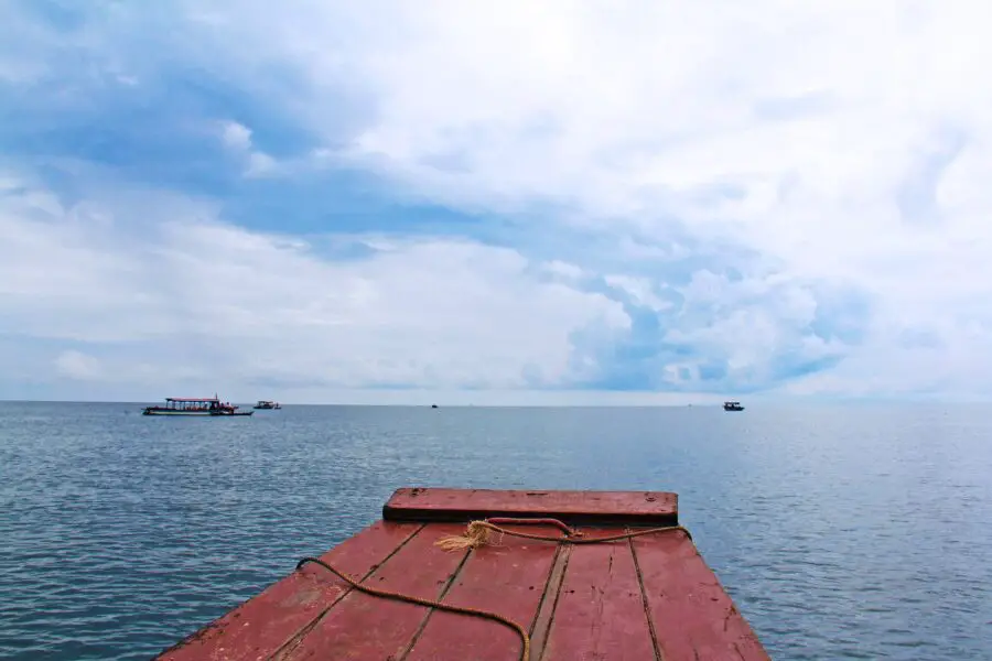 The vast blue Tonle Sap Lake (the best place to go if you're wondering what to do at Siem Reap) on a bright but cloudy day