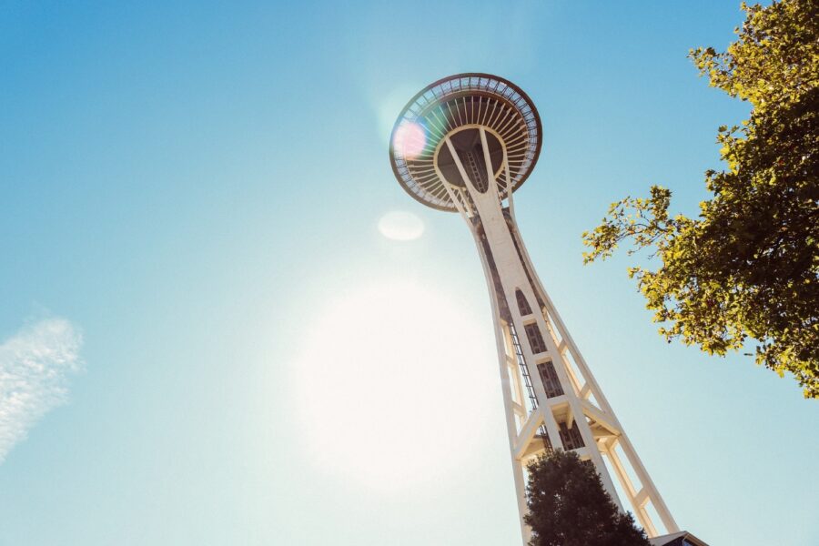 A view from the bottom of the towering Seattle Space Needle on a sunny day