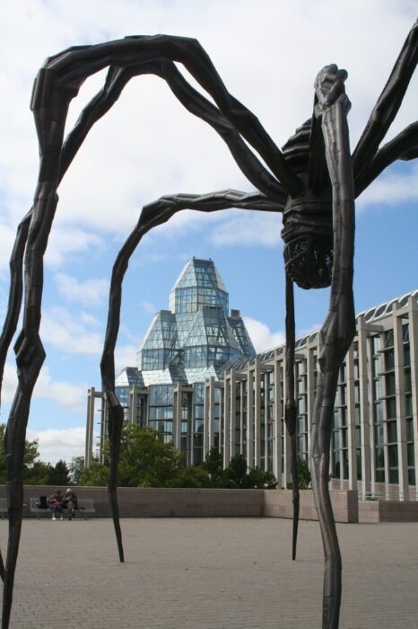 The black, spider-like sculpture in front of the glass building of the National Gallery of Canada in Ottawa, Canada