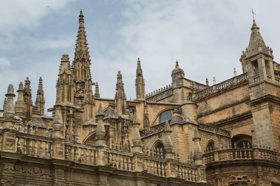 The spikes and gothic architecture of the Seville Cathedral on a cloudy day, the last official stop on my Seville self-guided walking tour.